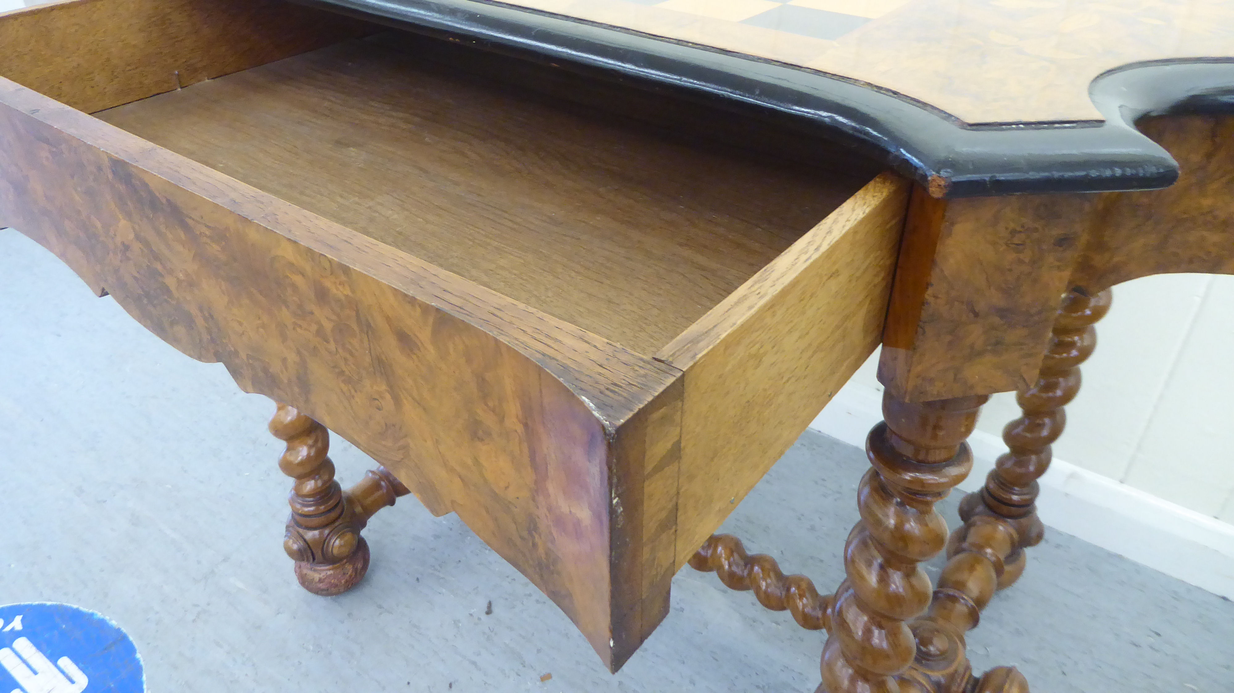 A late 19thC Continental figured walnut and floral marquetry games table with a serpentine - Image 3 of 12