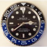 A dealer display, advertising wall timepiece for Rolex Oyster Perpetual Date; the movement faced