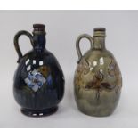 Two similar Royal Doulton stoneware ovoid shape liqueur decanters with strap handles, decorated in