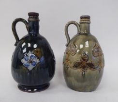 Two similar Royal Doulton stoneware ovoid shape liqueur decanters with strap handles, decorated in