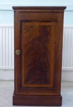 A late Victorian crossbanded and string inlaid mahogany pot cupboard, enclosed by a full-height