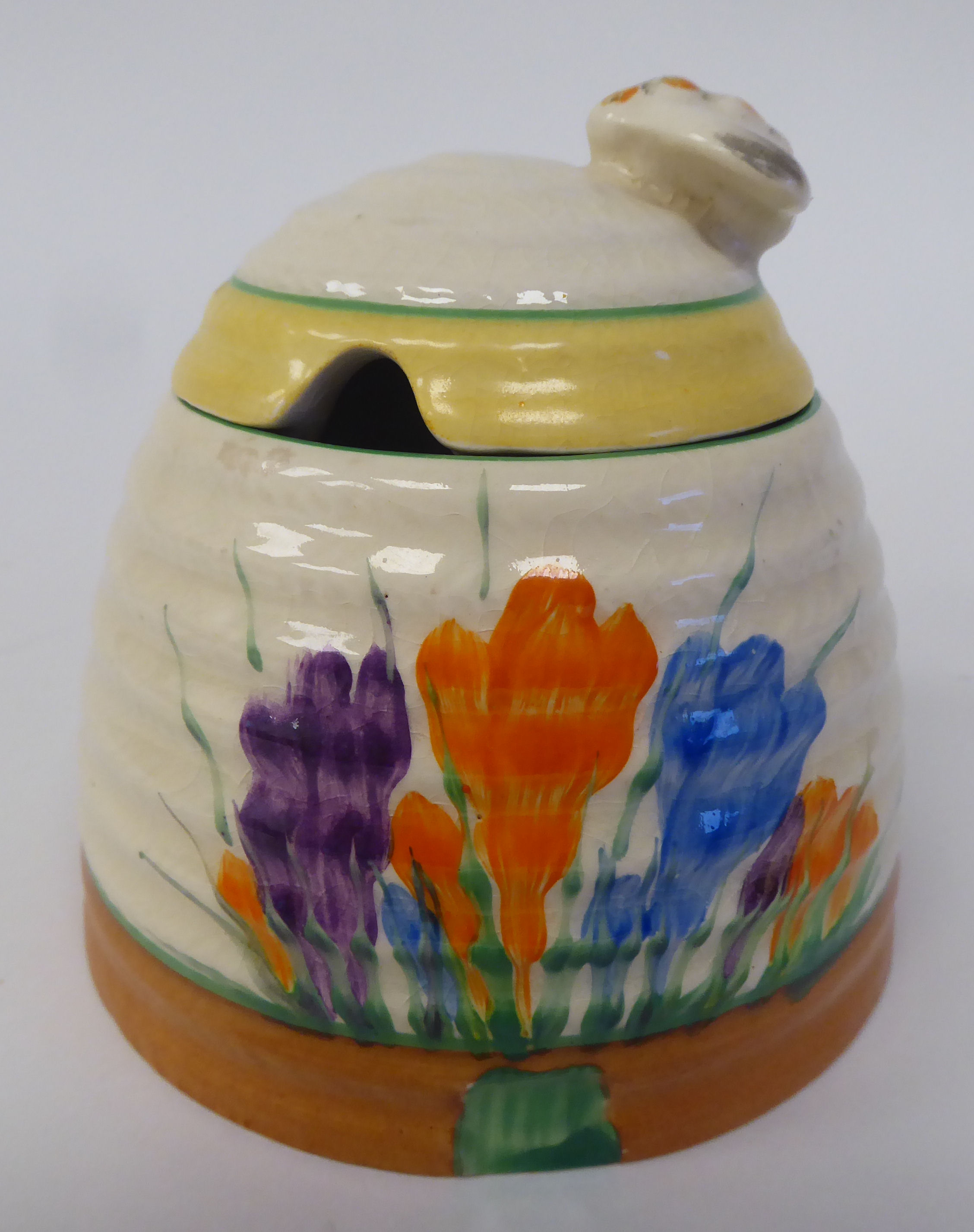 A Clarice Cliff Bizarre, Newport Pottery, Crocus pattern honeypot, the lid surmounted by a bee - Image 3 of 3