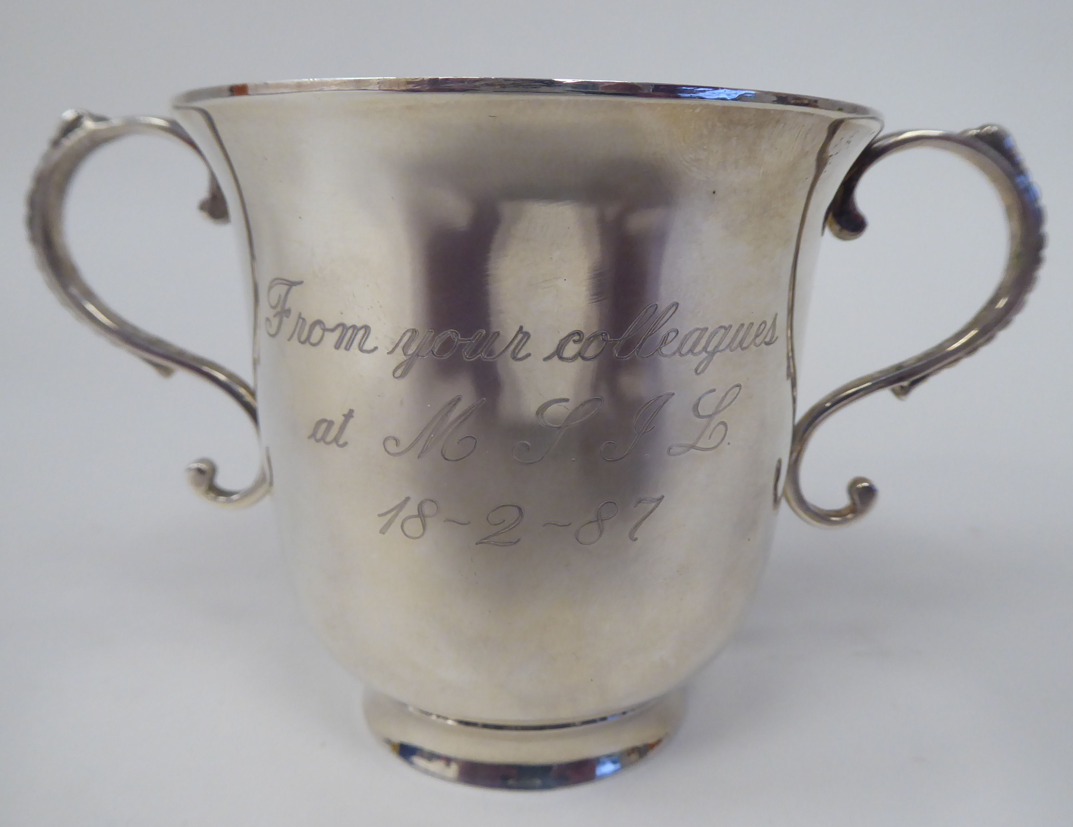 A silver twin handled, footed cup of bell design  Birmingham 1987  (approx. weight 4.5ozs)
