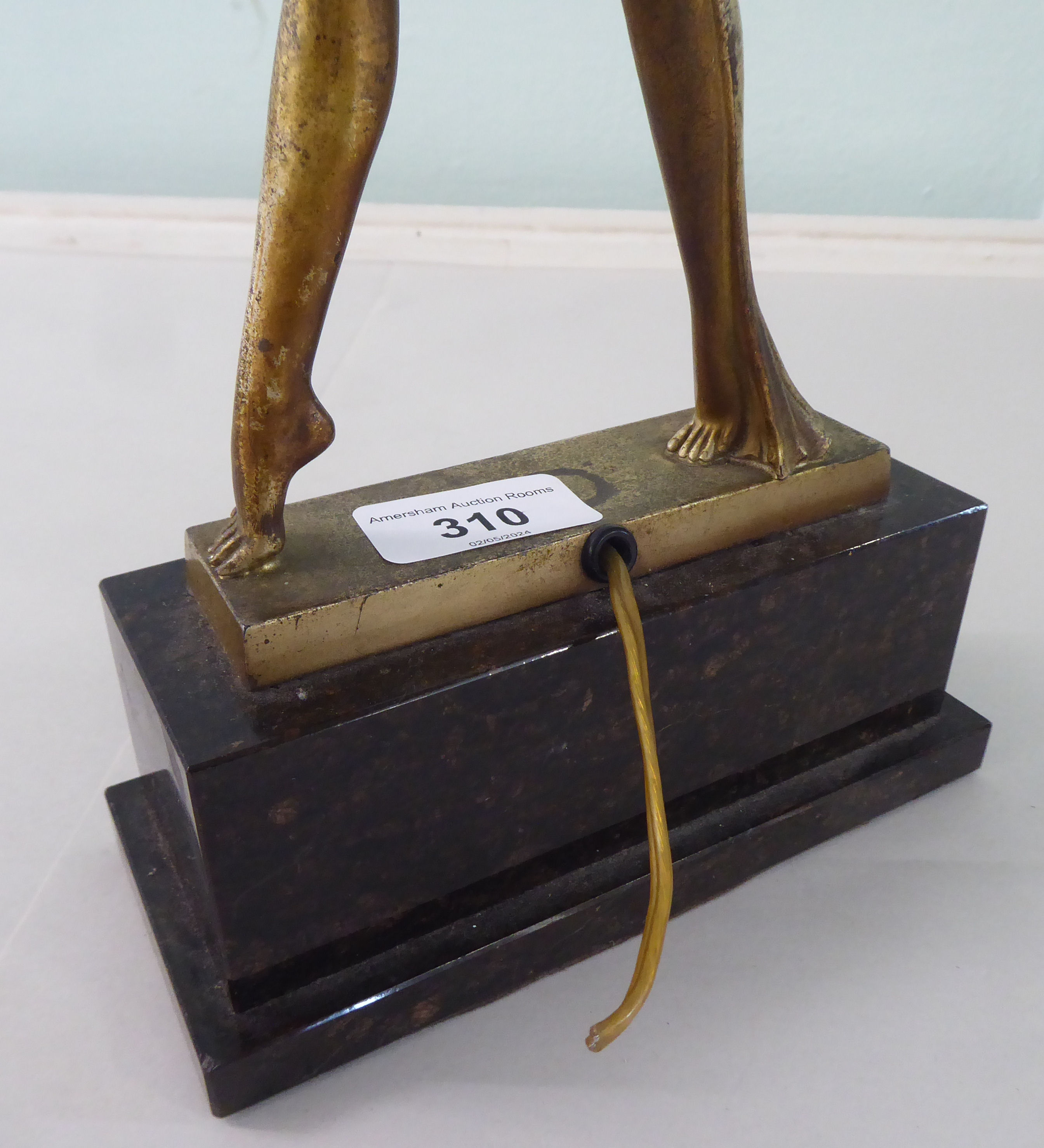 A 1930s Art Deco patinated and gilded table lamp. fashioned as a woman holding a white glass - Image 4 of 5
