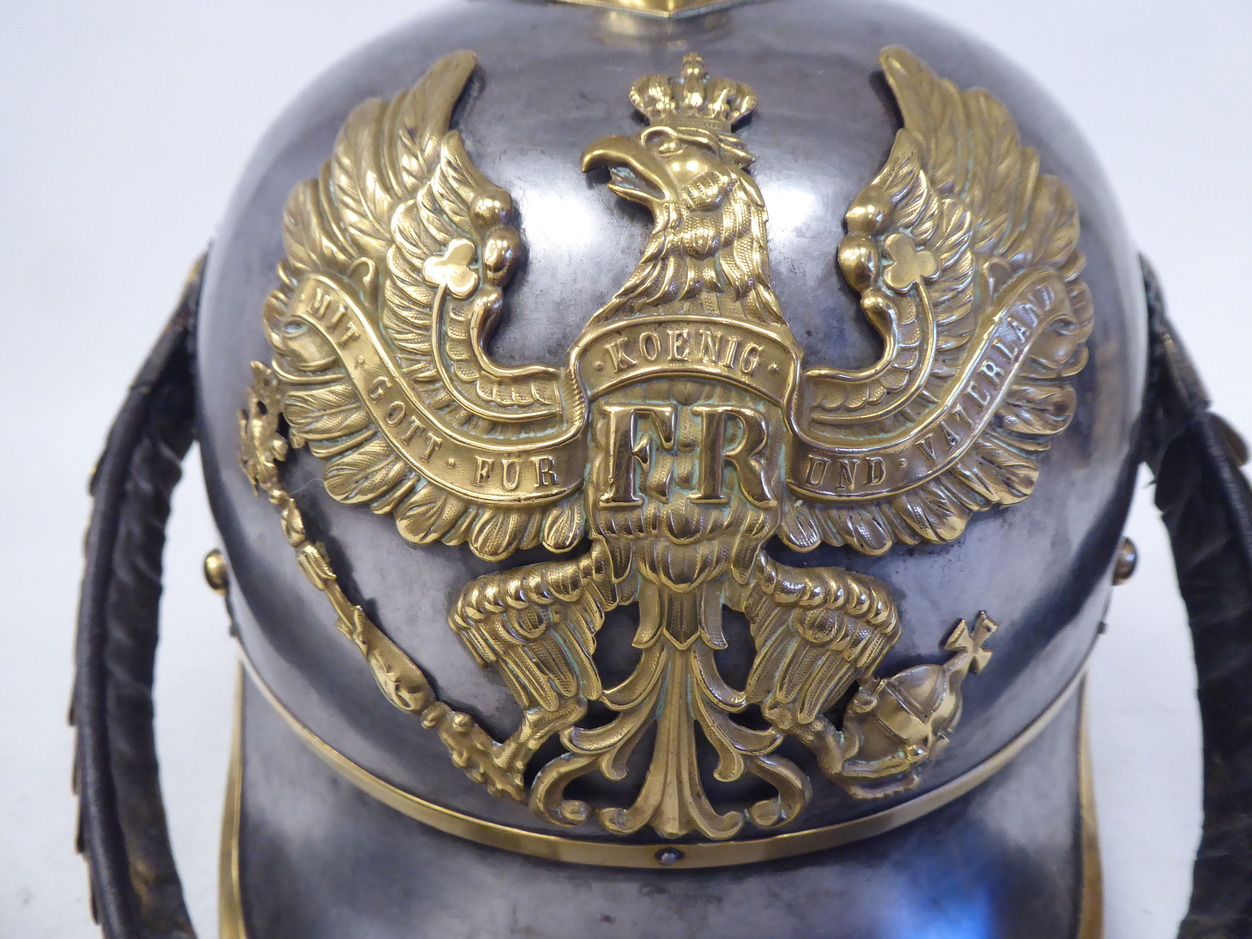 A German Great War spiked, polished steel and brass cavalry helmet with a hide liner and - Image 3 of 6