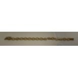 A 9ct gold pierced tablet link bracelet