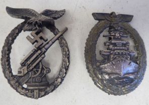 A German Kriegsmarine breast badge, by Schwerin of Berlin; and a Luftwaft Ack Ack breast badge (