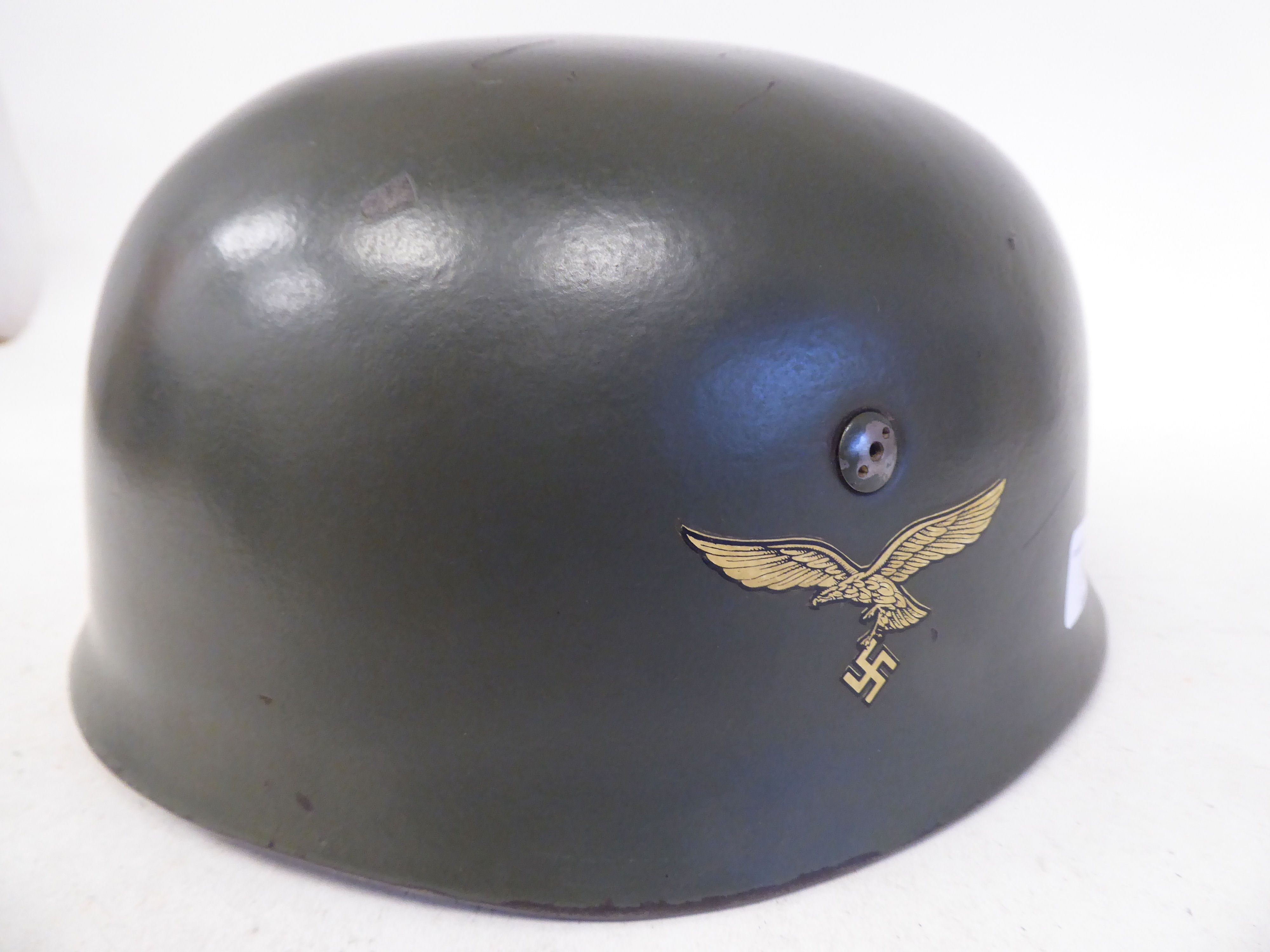 A German World War II Luftwaffe parachutist's steel helmet with a hide liner, harness strap and - Bild 2 aus 4