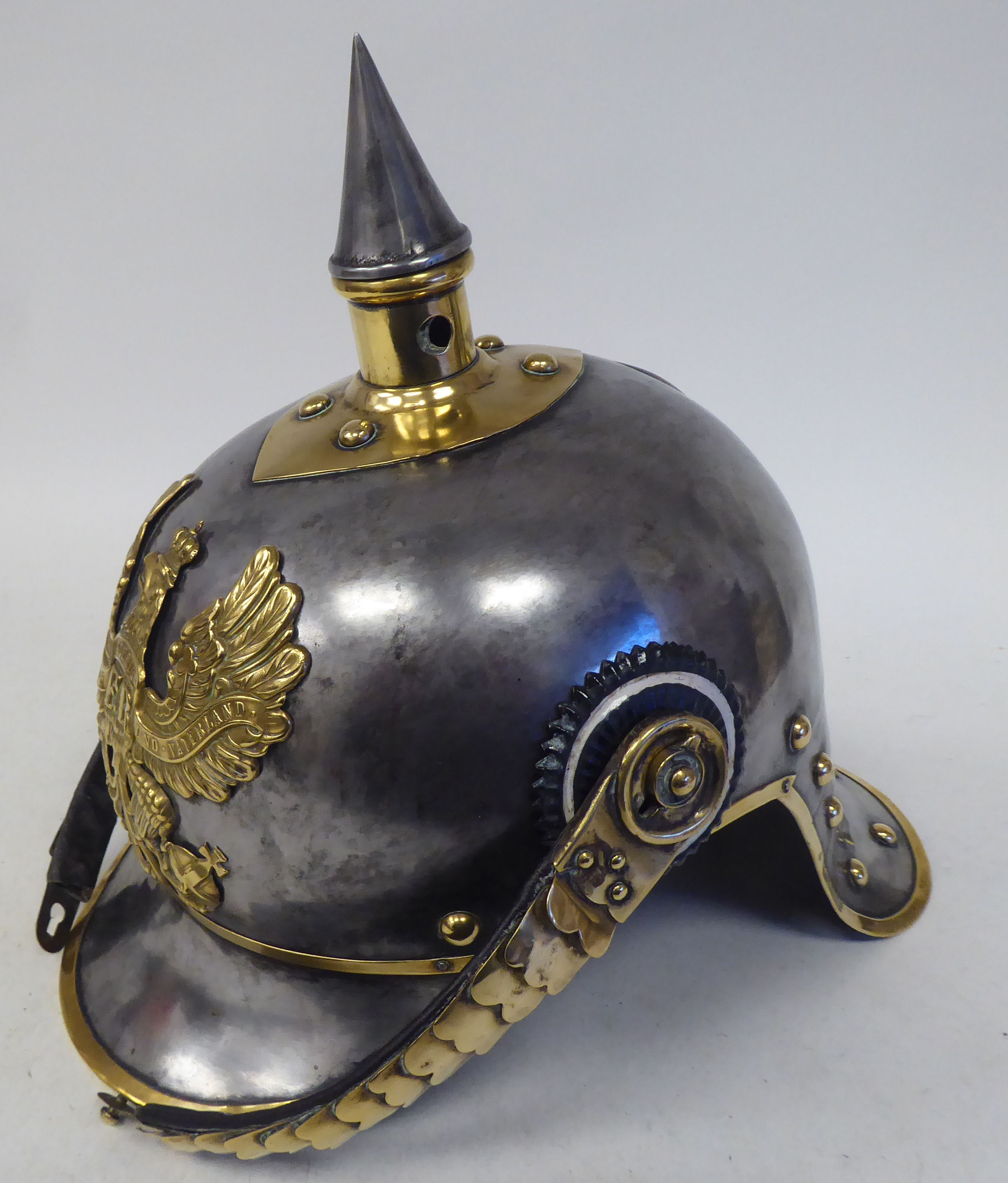 A German Great War spiked, polished steel and brass cavalry helmet with a hide liner and - Image 4 of 6