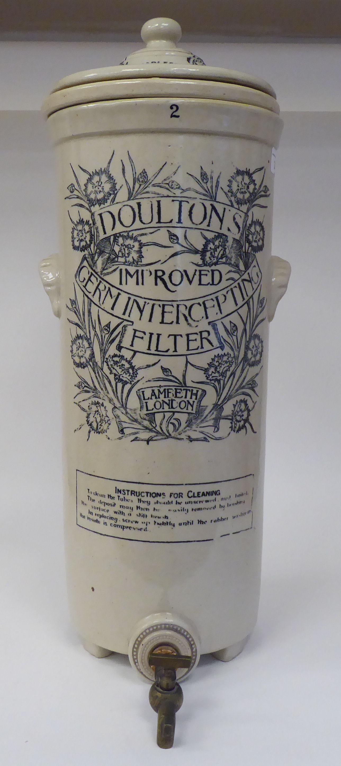 A late 19thC Doulton Lambeth Stoneware Improved Germ Intercepting Filter of cylindrical form with