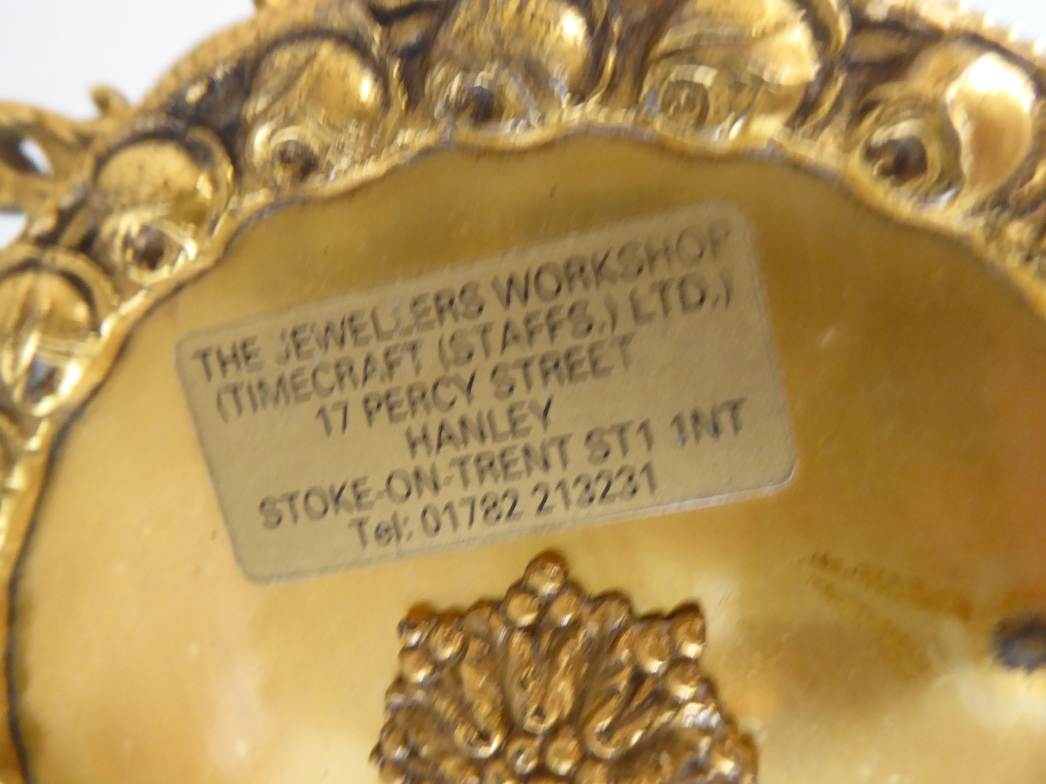 A mid 20thC Victorian design gilt metal mantel clock; the drum design movement faced by an enamelled - Image 5 of 7