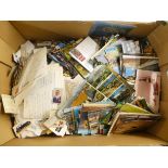 A miscellany of used and unused postage stamps, postcards and other themed collector's cards