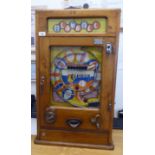 A vintage penny-in-the-slot, mechanical 'Playball' bagatelle machine, in a wall mountable light