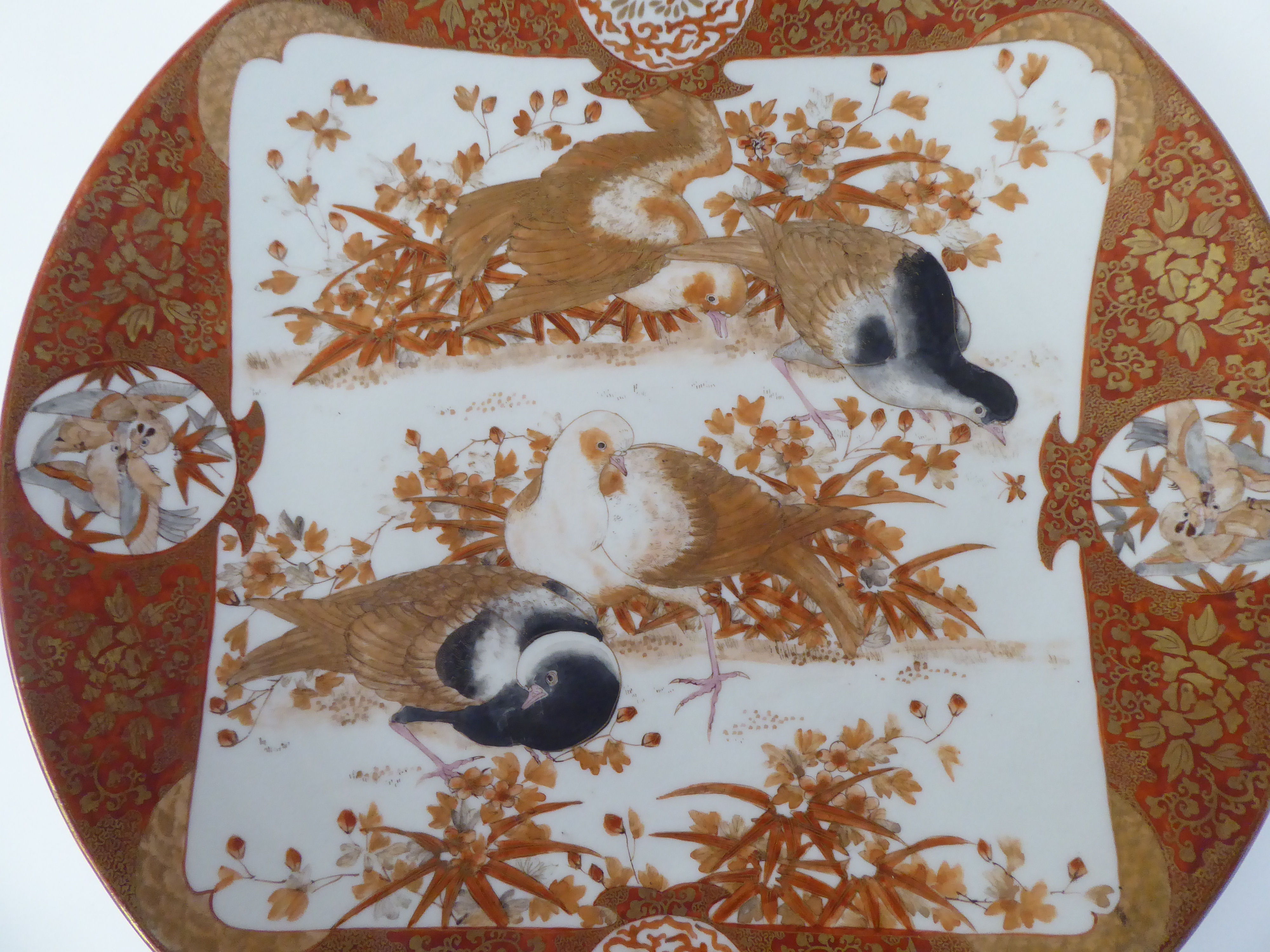 A late 19thC Japanese Kutani style porcelain charger, decorated in with vignette studies of birds, - Image 2 of 4