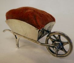A silver novelty pin cushion, fashioned as a wheelbarrow  Adie & Lovekin  Birmingham 1912