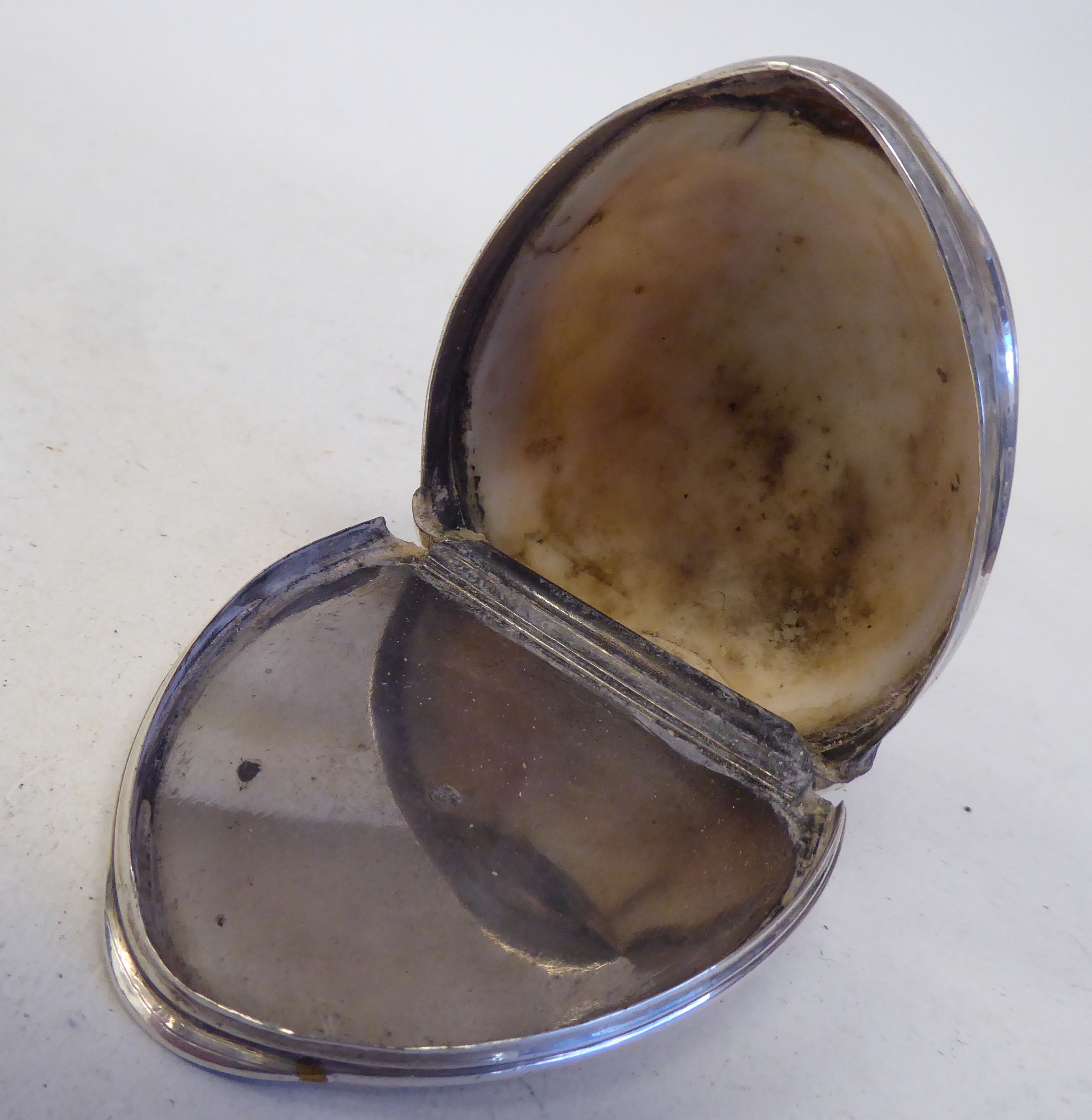 An 18th/19thC cowrie shell and silver mounted snuff box with a flush fitting hinged lid and - Image 3 of 3