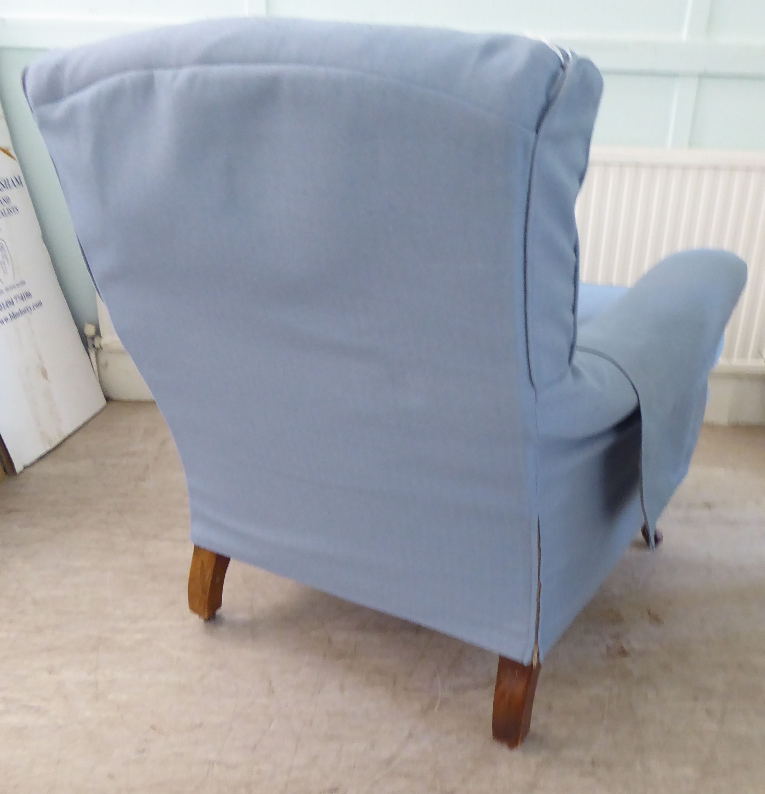 A late Victorian library chair with a level back and enclosed arms, re-upholstered in patterned blue - Image 4 of 4