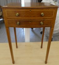 An Edwardian string inlaid mahogany serpentine front work table with a hinged lid, over a drawer,