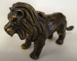 A vintage style bronze effect novelty vesta case, in the form of a standing lion