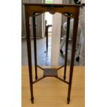 An Edwardian mahogany plant stand, raised on square, tapered legs and spade feet  27"h  12"sq