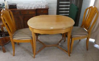 A 20thC bleached wood oval centre table, raised on splayed legs  29"h  38"w; and two Art Deco