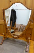 A modern Regency design yewwood shield shaped dressing table mirror, raised on splayed legs  22"h