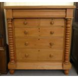 An early 20thC Scottish design, bleached pine six drawer dressing chest, on a plinth and turned feet