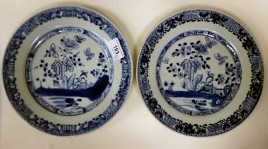 A pair of late 18thC Chinese porcelain plates, decorated with flora and insects  9"dia