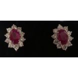 A pair of ruby and diamond set stud earrings