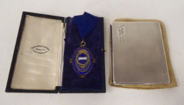 A silver cigarette case; and a silver medal, awarded to one AE Millard Esq, former President of