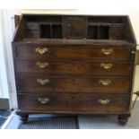 A George III mahogany bureau, the fall flap, over four graduated drawers, raised on turned feet