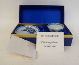 A Nanking Cargo porcelain tea bowl and saucer  bearing Christies lot numbers, in a fabric lined box