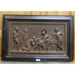 A bronze cast metal plaque, depicting Romans  12" x 22" in an ebonised frame