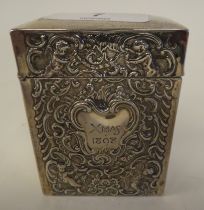 A late Victorian silver playing card box and cover with embossed swag and cherub decoration