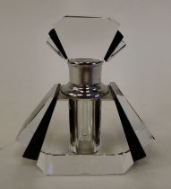 An Art Deco inspired black enamel and clear glass scent bottle and stopper