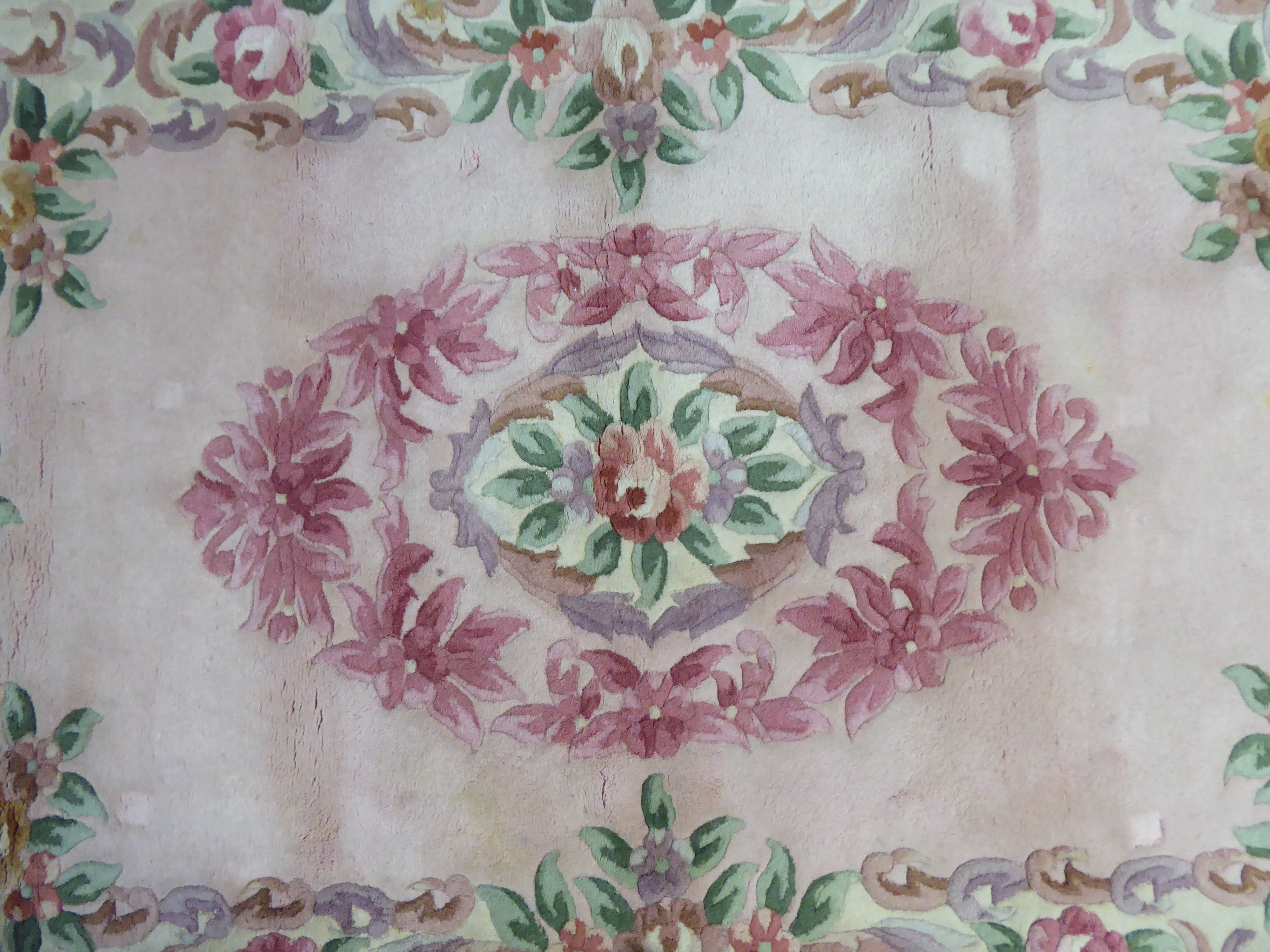 A Chinese wash rug, decorated in pastel tones, on a multi-coloured ground  49" x 74" - Image 2 of 4