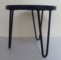 A Fornasetti style wrought metal framed low table, raised on splayed legs  11"h  12"dia
