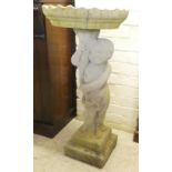 A composition stone birdbath, the column fashioned as a child, on a stepped plinth  33"h