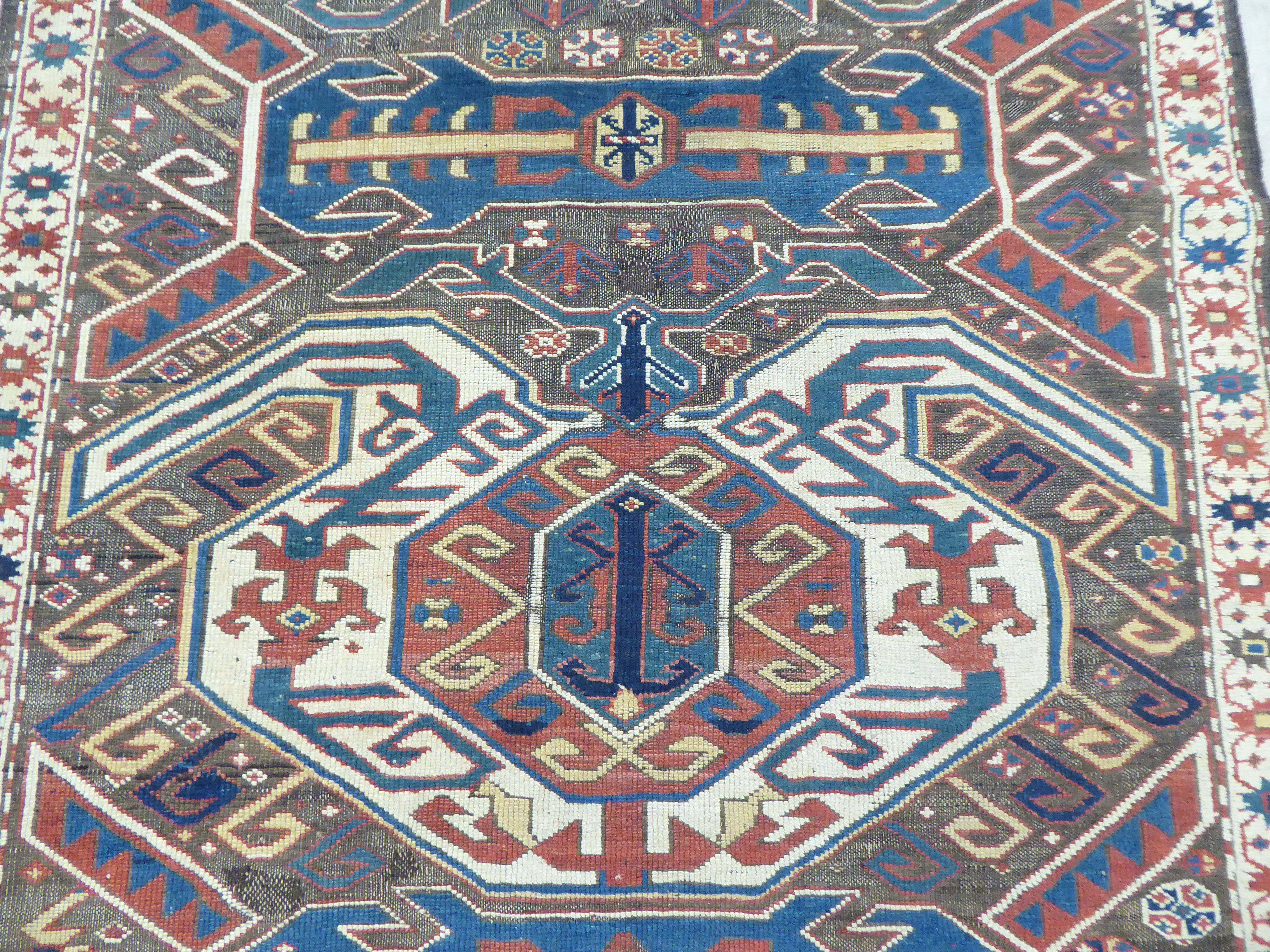 A Turkish Kilim style runner, decorated with repeating stylised designs, on a multi-coloured ground - Image 2 of 4
