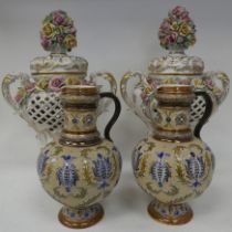 Ceramics: to include a pair of Mettlach stoneware ewers, decorated with embossed flora  10"h