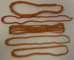Five coral necklaces, on yellow metal clasps