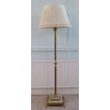 A modern standard lamp, the brass Corinthian capital column, on a stepped, square, onyx base with