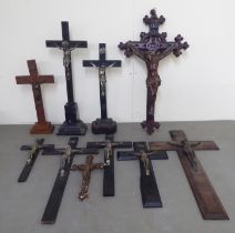 A collection of variously sized and mounted crucifix  largest 18.5"h