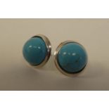 A pair of silver coloured metal turquoise set stud earrings  stamped 925