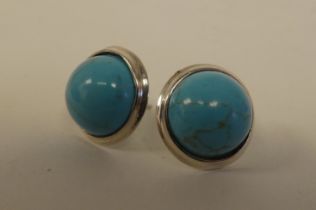 A pair of silver coloured metal turquoise set stud earrings  stamped 925