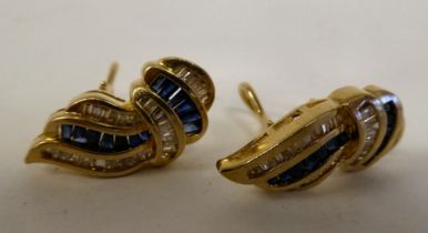 A pair of gold coloured metal sapphire and diamond set earrings