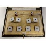 A set of 9ct yellow gold and 18ct white gold shirt studs and cufflinks, set with sapphires  boxed