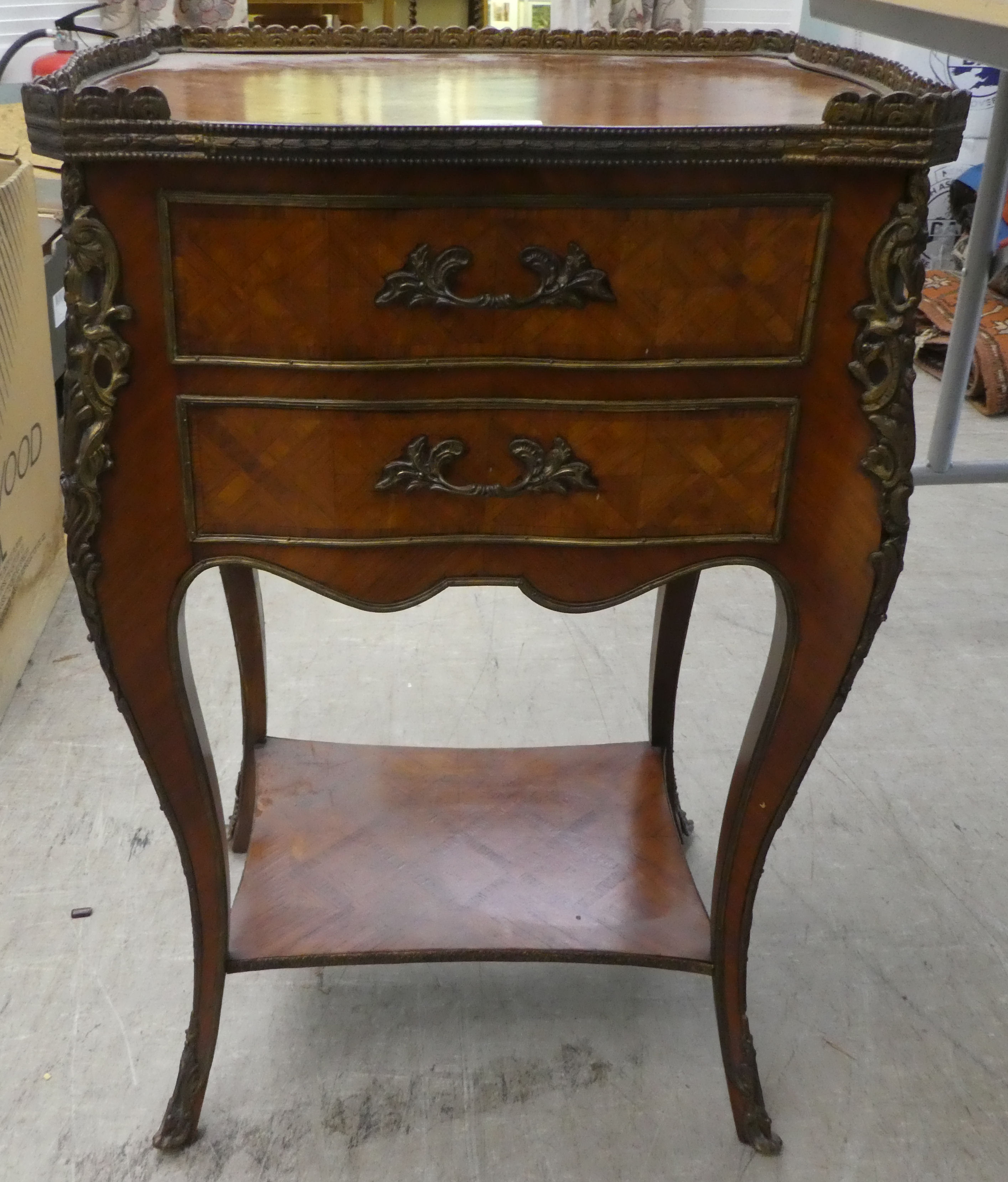 A mid 20thC Louis XV design parquetry inlaid kingwood bedside chest with gilt metal mounts and two