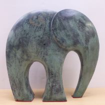 A cast bronze effect composition model, a baby elephant  12"h