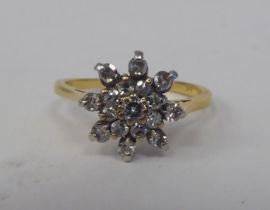 An 18ct gold cluster ring, set with diamonds